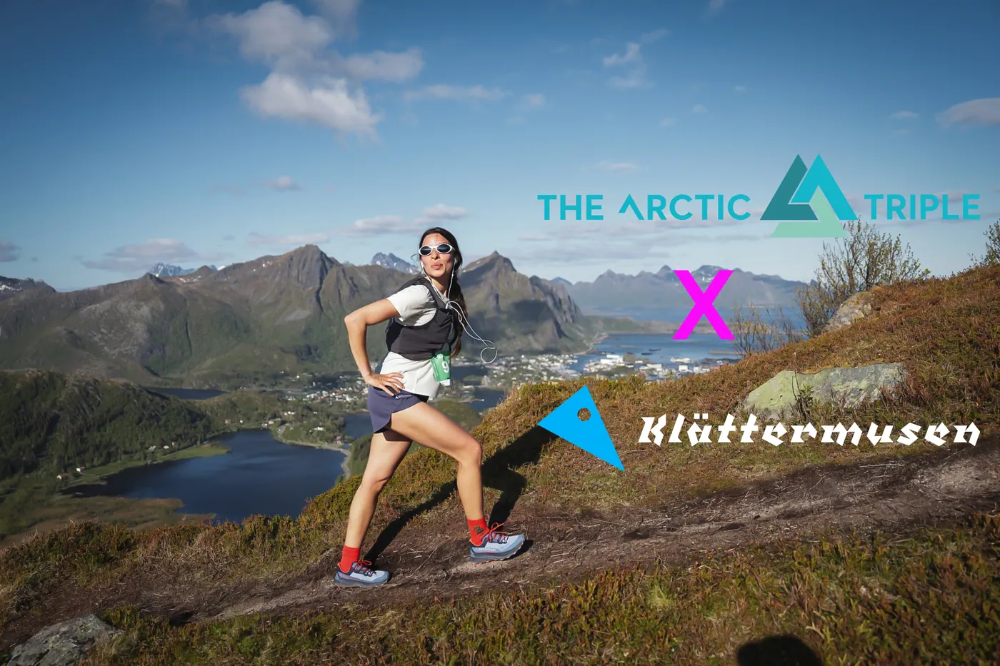 A trail runner poses on a mountain path above Svolvær, with the logos of The Arctic Triple and Klättermusen